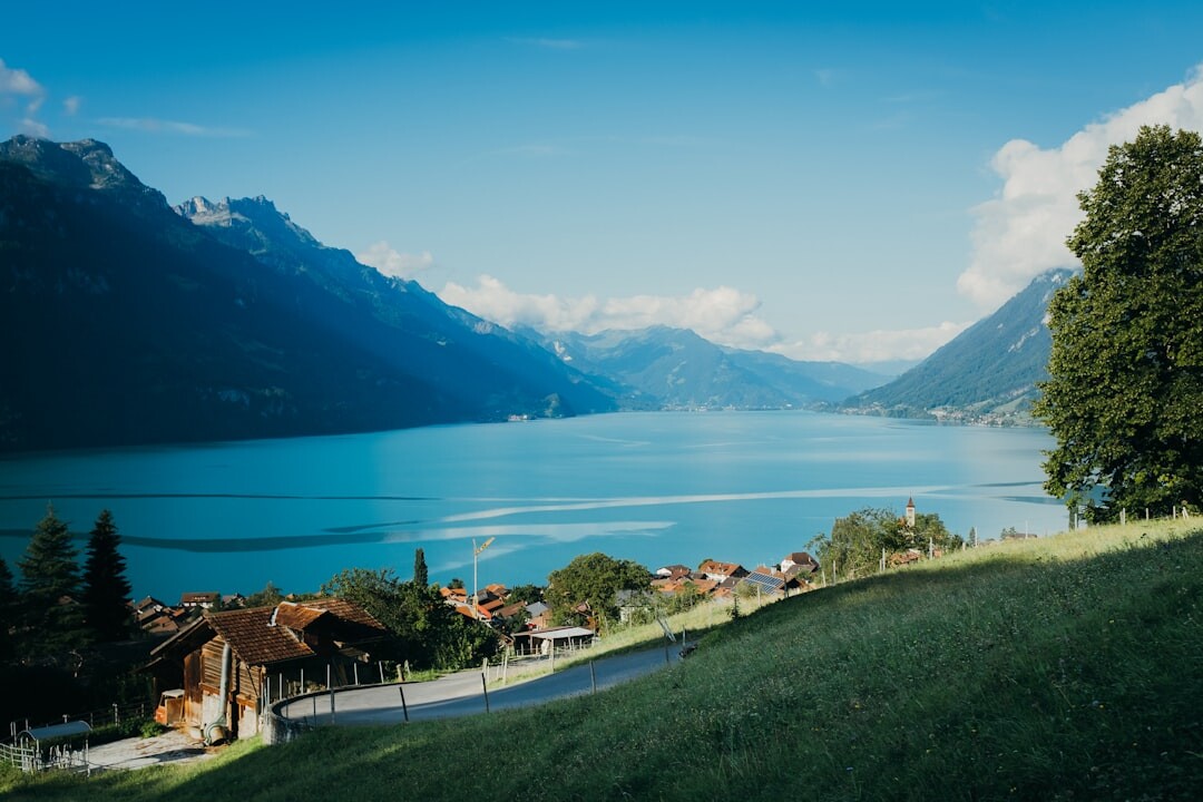 Camera on a tripod filming a landscape near a Swiss lake