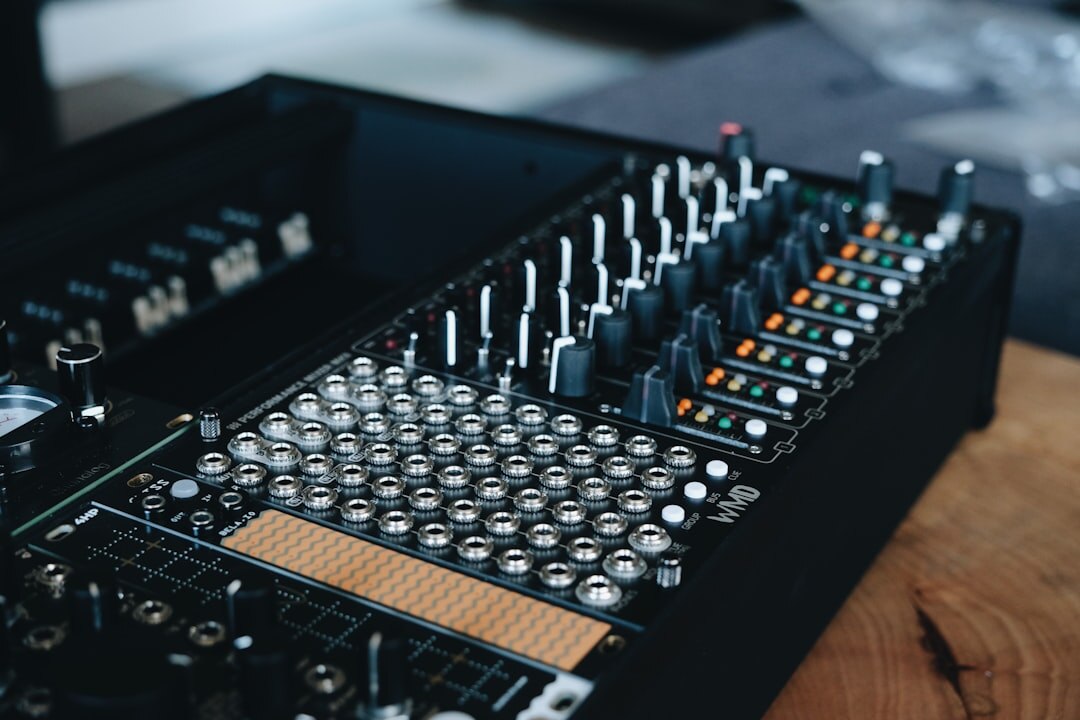 Audio mixing console with faders for sound design